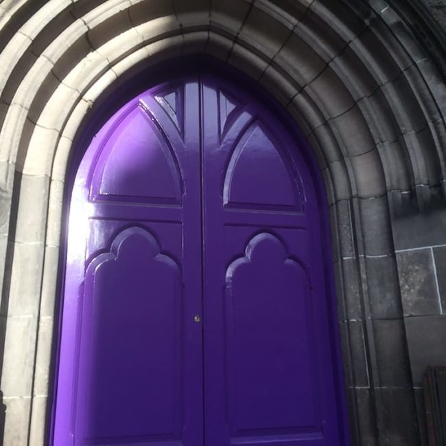 A purple church door in Inverness, Scotland.